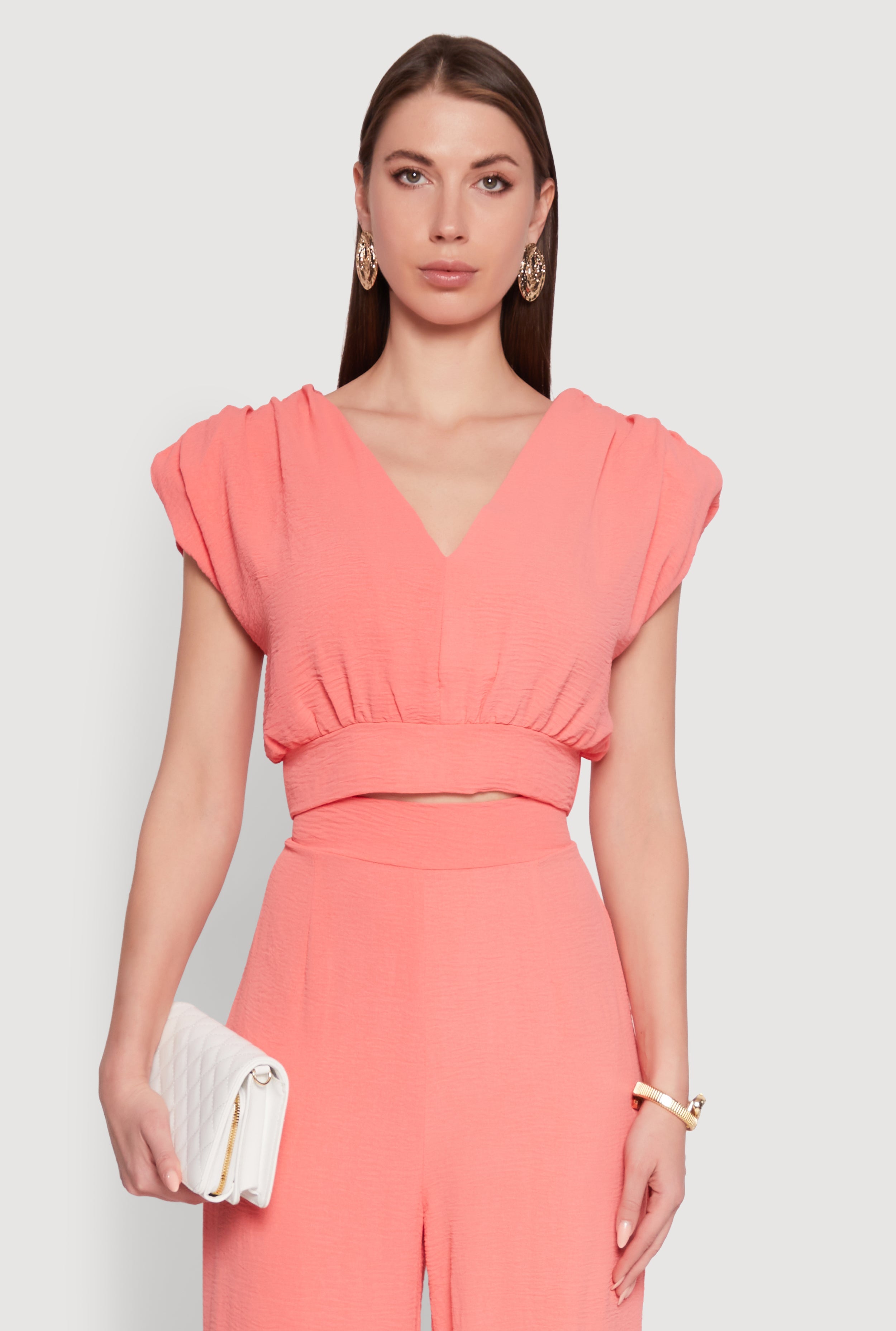 Chic Crepe Knit Blouse with Padded Shoulders and Tie Back